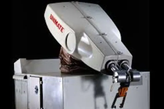 A Unimate robotic arm positioned on an automotive assembly line