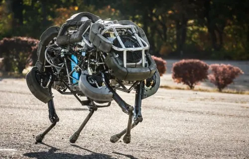 A four-legged robot walking on rough outdoor terrain