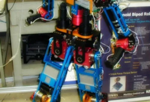 Full-body humanoid robot with visible joints and mechanical limbs, standing upright