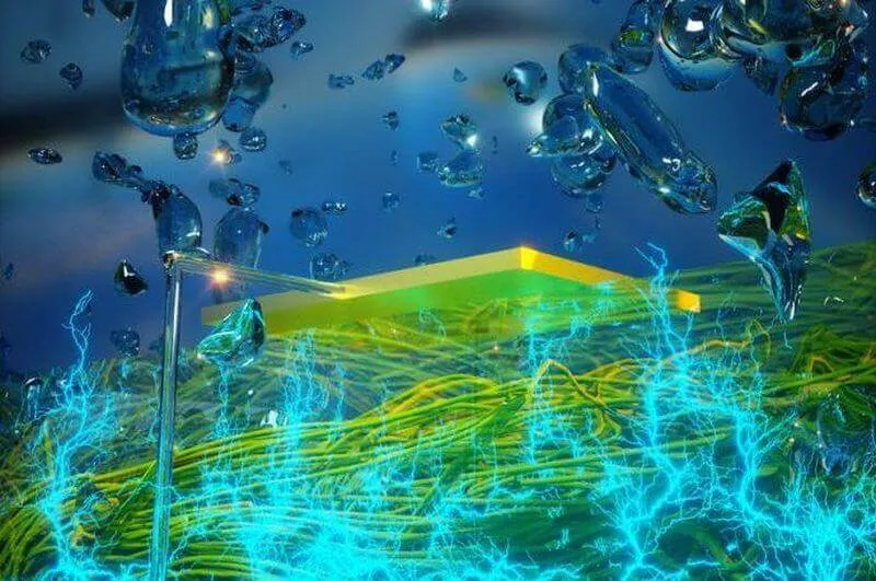 Close-up of a microscale device or chip on a surface, with fine wiring or connectors visible