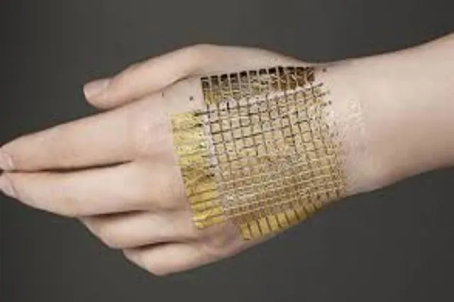 Thin flexible sheet of electronic material bent or wrapped around a surface