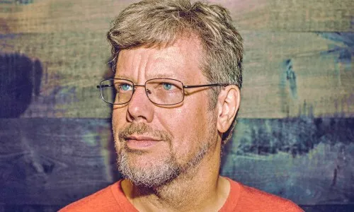Guido van Rossum seated or standing, or a terminal showing early Python code