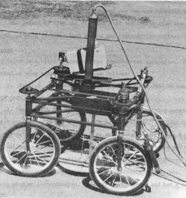 Four-wheeled cart tethered by a cable, with a camera mounted at the front
