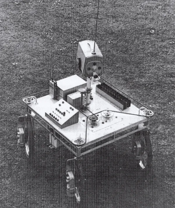 Four-wheeled cart fitted with radio-control equipment and a forward-facing camera