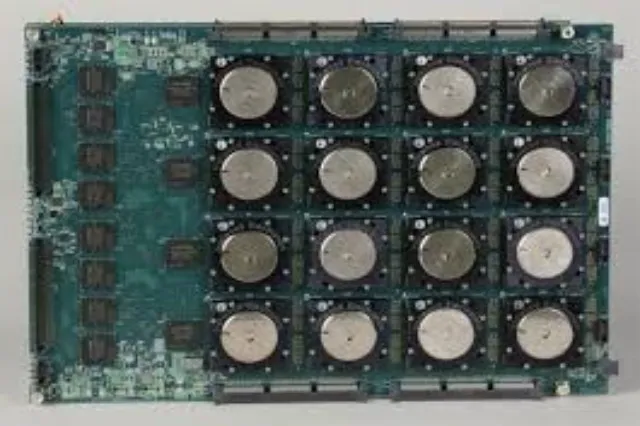 A small square microchip on a fingertip or surface, showing the scale of the TrueNorth integrated circuit